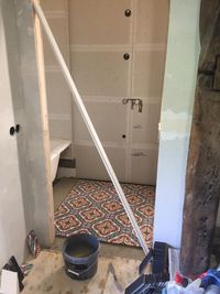 Tiling the bathroom downstairs